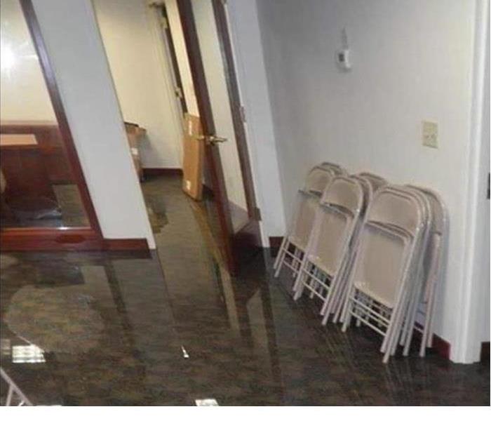 flooring with standing water in a business